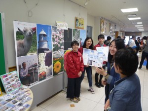 Four students in front of the booth.