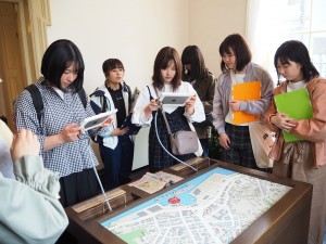 Use a tablet to check the old streets of Karato